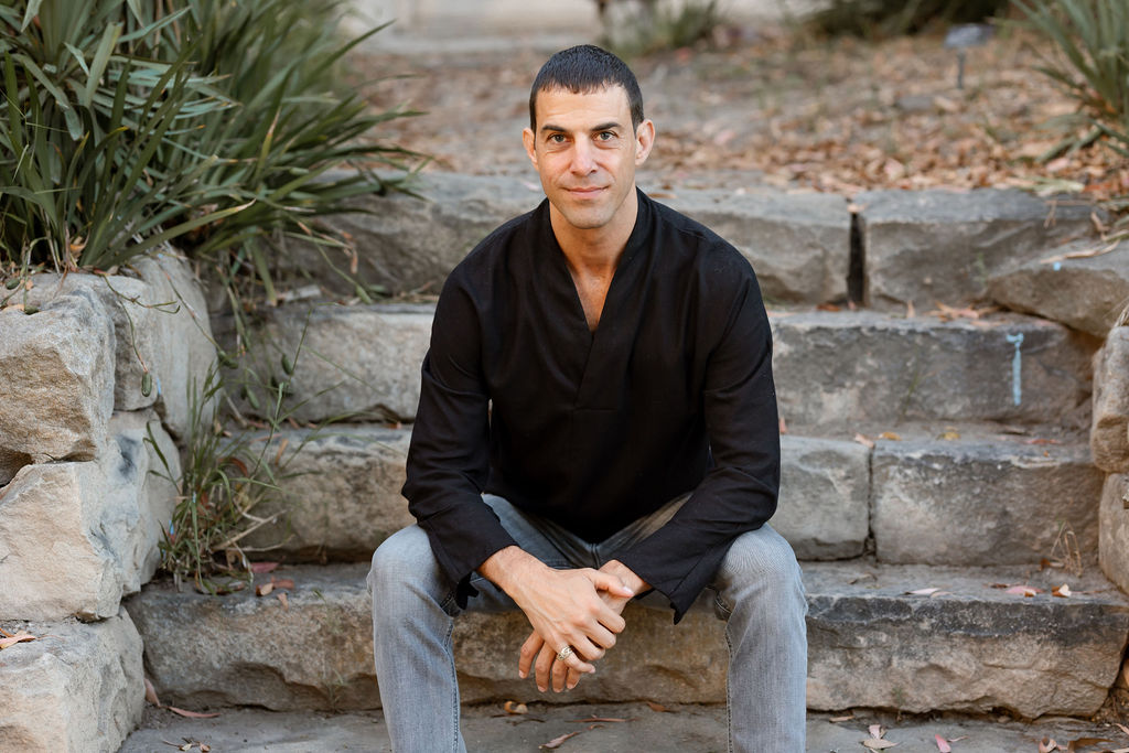 Nathanael seated on stone steps
